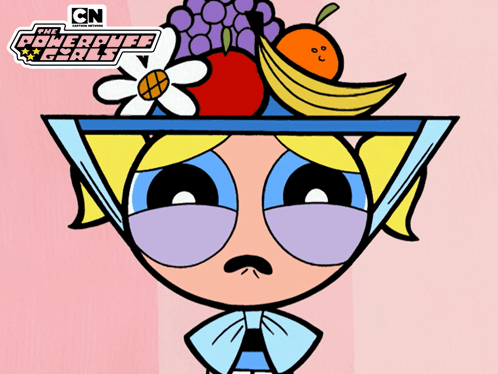 An Advertisement For The Powerpuff Girls Shows A Girl With A Bowl Of Fruit On Her Head GIF