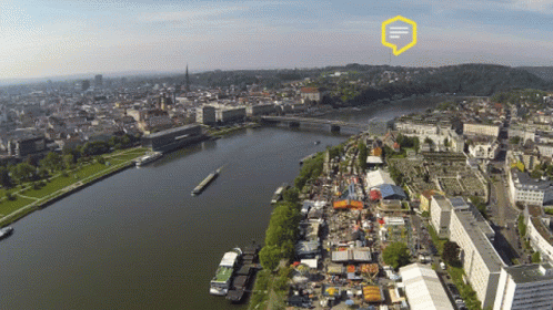 An Aerial View Of A City And A River With A Yellow Speech Bubble That Says ' I ' On It GIF
