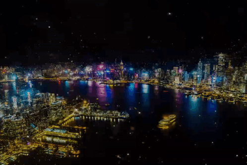 An Aerial View Of A City At Night With A Lot Of Lights GIF