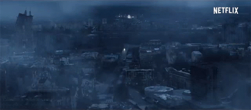 An Aerial View Of A City At Night With Netflix Written In The Corner GIF