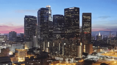 An Aerial View Of A City Skyline At Night With A Watermark That Says ' 2013 ' On It GIF