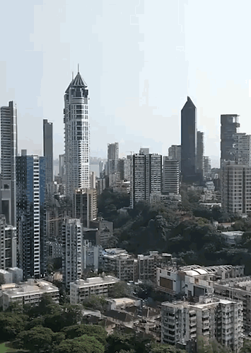 An Aerial View Of A City Skyline With Lots Of Tall Buildings GIF