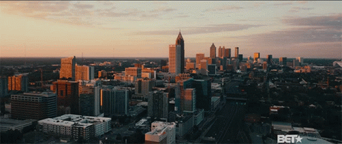 An Aerial View Of A City With A Bet Logo On The Bottom Right GIF