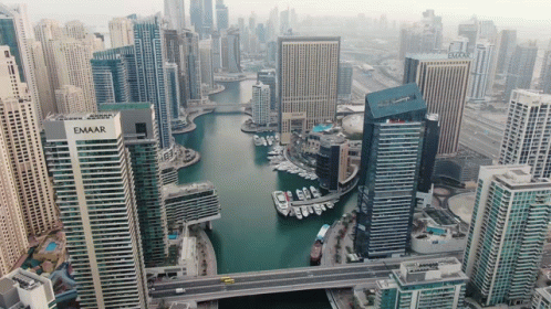 An Aerial View Of A City With A Building That Has The Word Emaar On It GIF