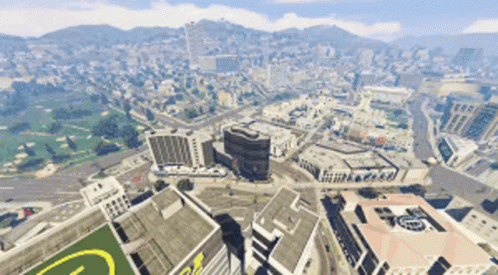 An Aerial View Of A City With A Large Building With The Letter G On The Roof GIF
