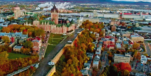 An Aerial View Of A City With A Large Castle In The Center GIF