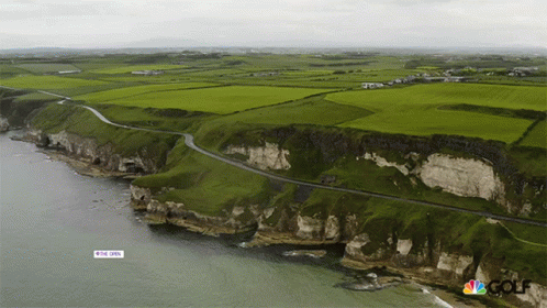 An Aerial View Of A Cliff With A Sign That Says ' The Open ' On It GIF
