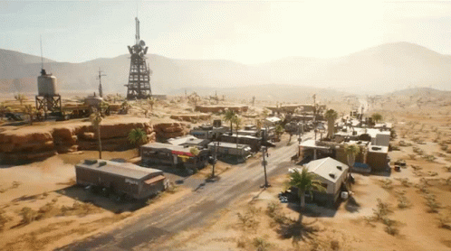 An Aerial View Of A Desert Landscape With A Few Buildings And A Water Tower With The Word Phoenix On It GIF