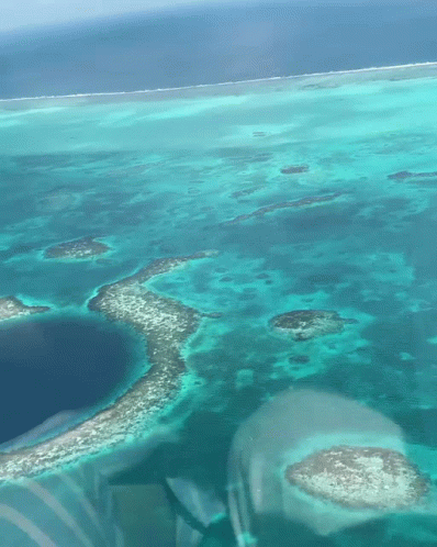 An Aerial View Of A Large Body Of Water With Small Islands GIF