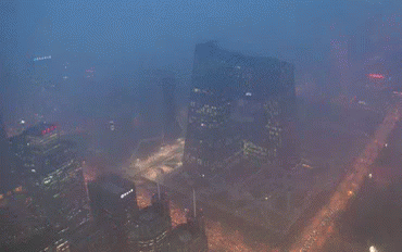 An Aerial View Of A Large City At Night GIF