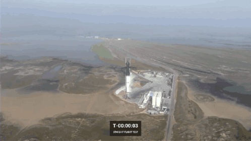 An Aerial View Of A Rocket Being Launched With T 00 00 01 Displayed On The Screen GIF