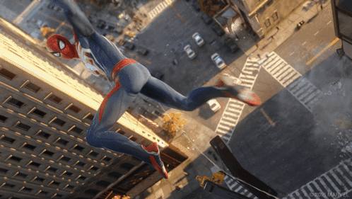 An Aerial View Of A Spider-Man Jumping Over A City Street GIF