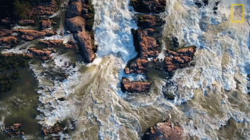 An Aerial View Of A Waterfall With The National Geographic Logo Visible GIF