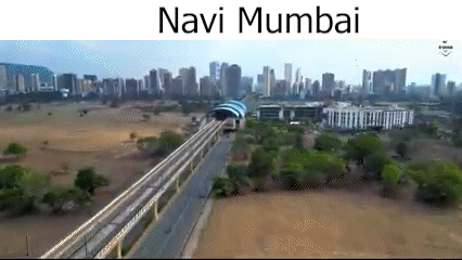 An Aerial View Of Navi Mumbai With A Train Going Through The City GIF