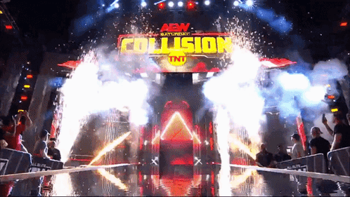 An Aew Saturday Collision Tnt Event With Fireworks Coming Out Of It GIF