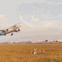 An Airitalia Plane Is Flying Through The Sky GIF