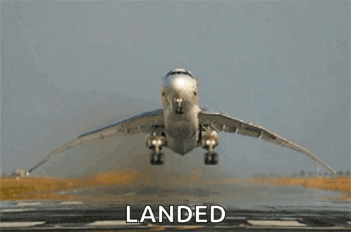 An Airplane Is Taking Off From A Runway And The Word Landed Is On The Bottom GIF