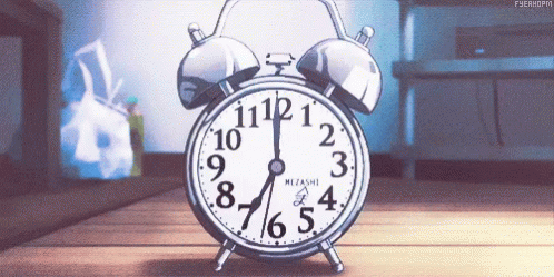 An Alarm Clock Is Sitting On A Wooden Floor And Shows The Time As 4:20 GIF