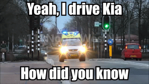 An Ambulance Is Driving Down A Street With The Words Yeah I Drive Kia How Did You Know GIF