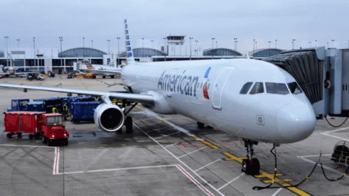 An American Airlines Plane Is Parked At The Airport GIF