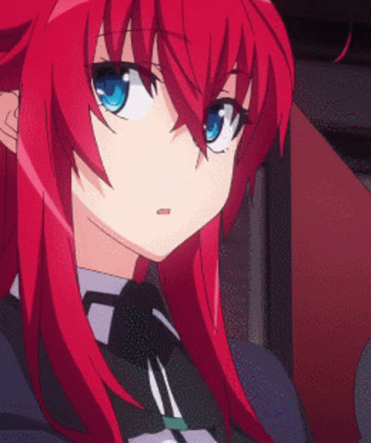 An Anime Girl With Red Hair And Blue Eyes GIF