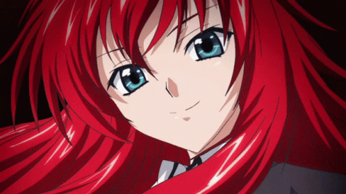 An Anime Girl With Red Hair And Blue Eyes GIF