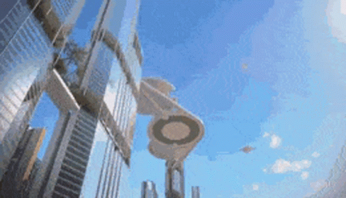An Artist 'S Impression Of A Futuristic City With A Ufo Flying Overhead GIF