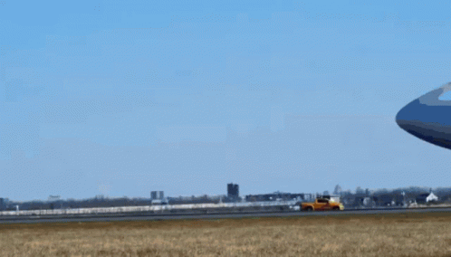 An Atl Airplane Is Taking Off From An Airport Runway GIF
