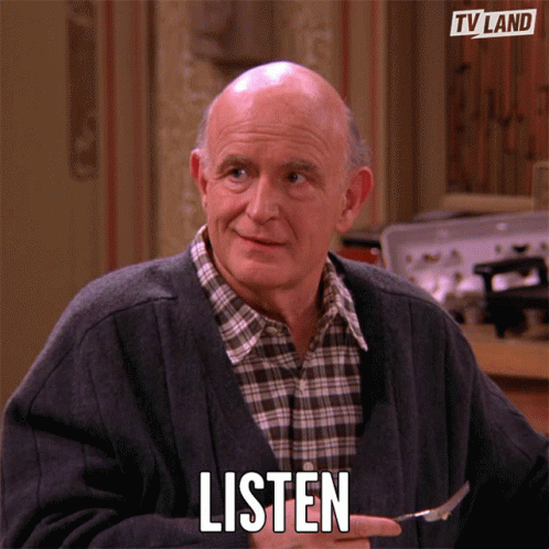 An Elderly Man Is Holding A Fork In His Hand And Says Listen GIF