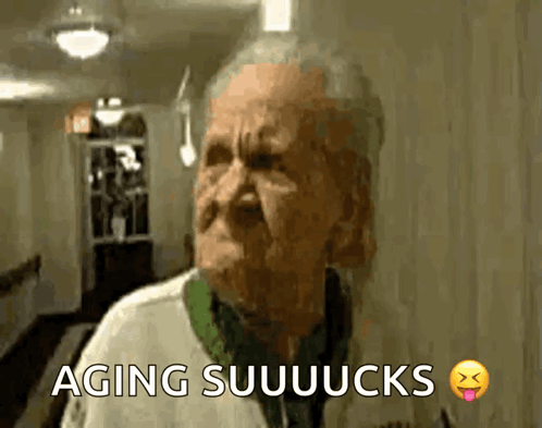 An Elderly Man Is Making A Funny Face And The Words Aging Suuuucks Are Above Him GIF