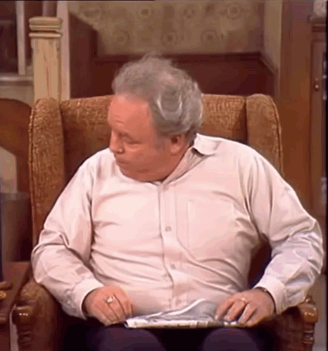 Elderly Man Reading Newspaper GIF