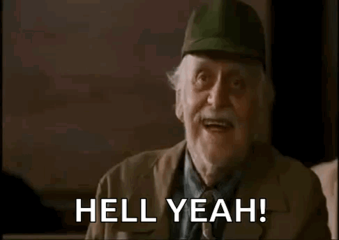 An Elderly Man Wearing A Baseball Cap Is Making A Funny Face And Saying `` Hell Yeah '' . GIF