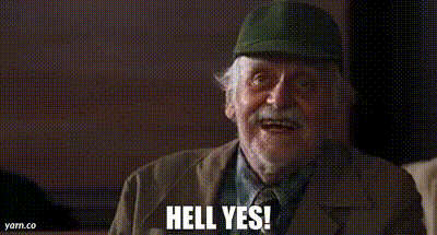 An Elderly Man Wearing A Hat And A Suit Is Smiling And Saying `` Hell Yes '' . GIF