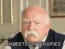 An Elderly Man With A Mustache Is Sitting In A Living Room And Saying `` Diabetes Intensifies '' . GIF