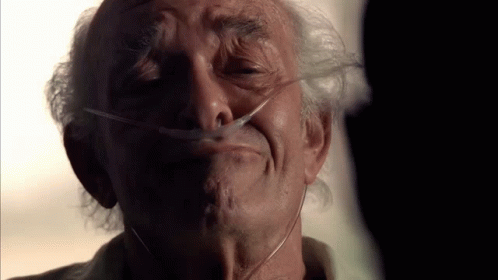 An Elderly Man With An Oxygen Mask On His Face GIF