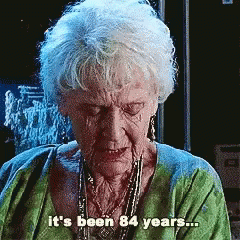 An Elderly Woman In A Green Shirt Says It 'S Been 84 Years ... GIF