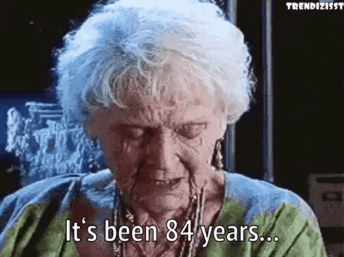 An Elderly Woman Is Crying And Saying It 'S Been 84 Years GIF