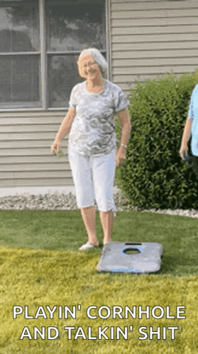 An Elderly Woman Is Playing Cornhole And Talking Shit GIF