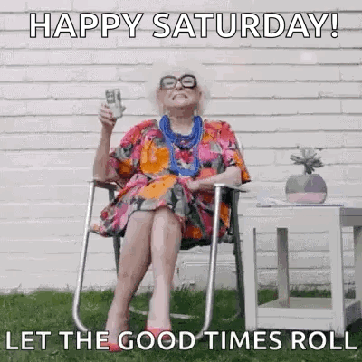 an elderly woman is sitting in a folding chair holding a glass of beer .