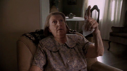An Elderly Woman Is Sitting On A Couch And Saying I Don 'T GIF