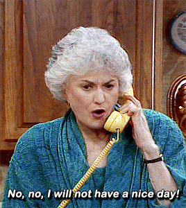 An Elderly Woman Is Talking On A Yellow Telephone And Saying No No I Will Not Have A Nice Day GIF