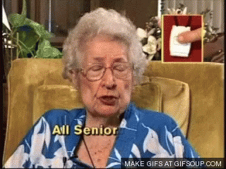 An Elderly Woman Sitting In A Chair With The Words All Senior Written On Her Chest GIF