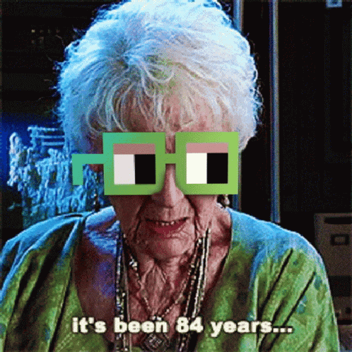 An Elderly Woman Wearing A Pair Of Glasses That Say It 'S Been 84 Years GIF