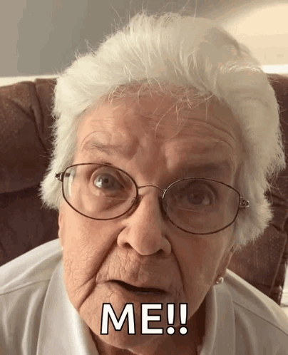 An Elderly Woman Wearing Glasses Says Me ! GIF