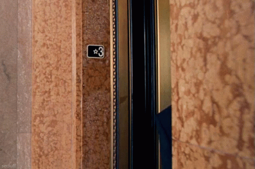 An Elevator With The Number 3 On The Wall GIF