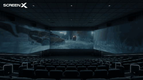 An Empty Movie Theater With A Screen X Logo In The Corner GIF