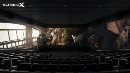 An Empty Movie Theater With A Screen X Logo On The Top GIF