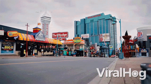 An Empty Street With A Sign That Says Viralhog GIF
