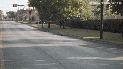 an empty street with the hashtag #walkertexasranger on the bottom