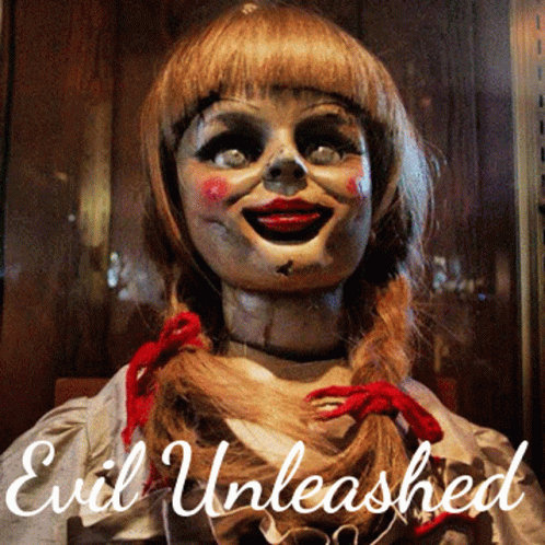 An Evil Unleashed Poster With A Doll In The Foreground GIF